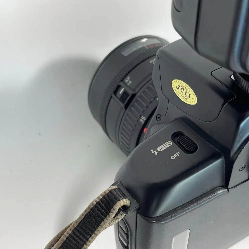 Canon E05 750 35mm camera and Nikon Fun touch 2 35mm camera